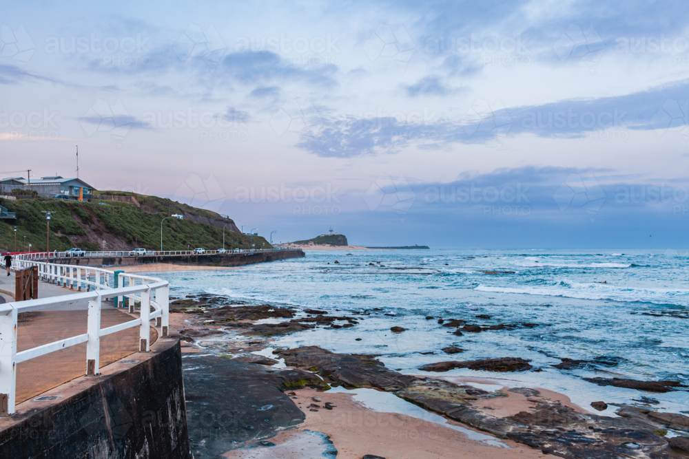 Rocky ocean view along the coast at dusk in Newcastle NSW Australia - Australian Stock Image