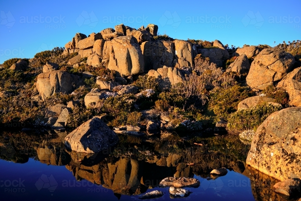 Rocky Outcrop above a Little Pond on Mount Wellington - Australian Stock Image