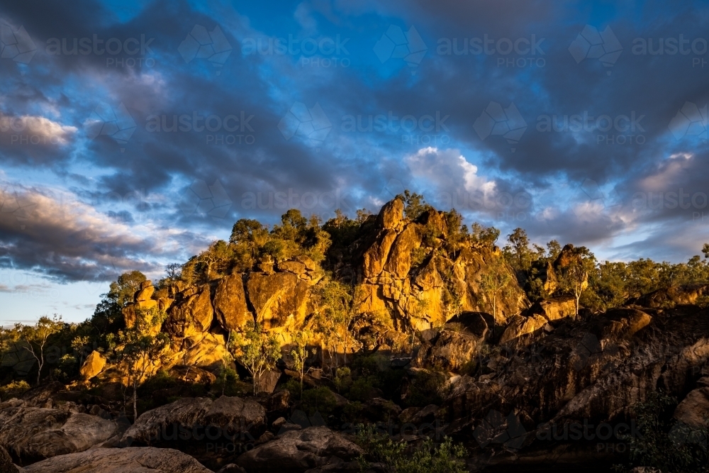 rocky outcrop lit by the sunset - Australian Stock Image
