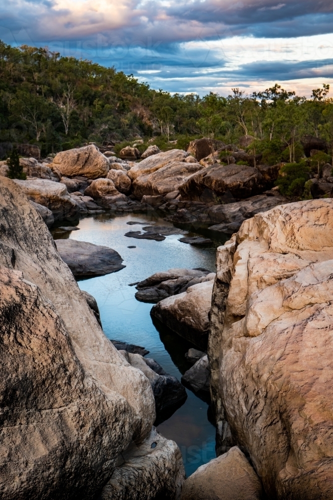 Rocky river and waterhole at sunset - Australian Stock Image