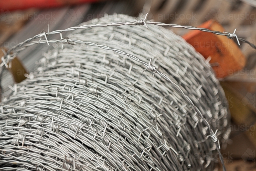 Roll of barbed wire for fencing - Australian Stock Image