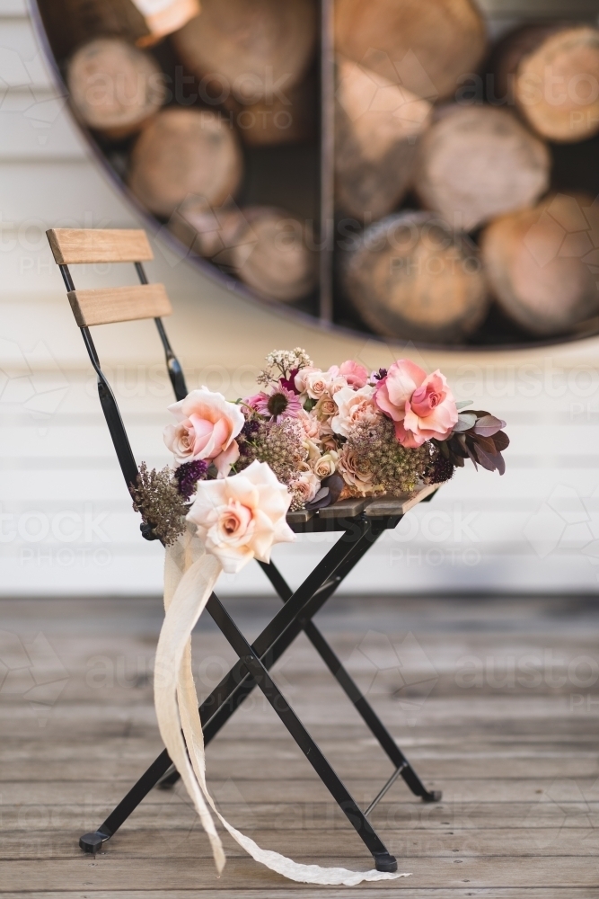 Rose Bouquet with Ribbon on Rustic Seat - Australian Stock Image