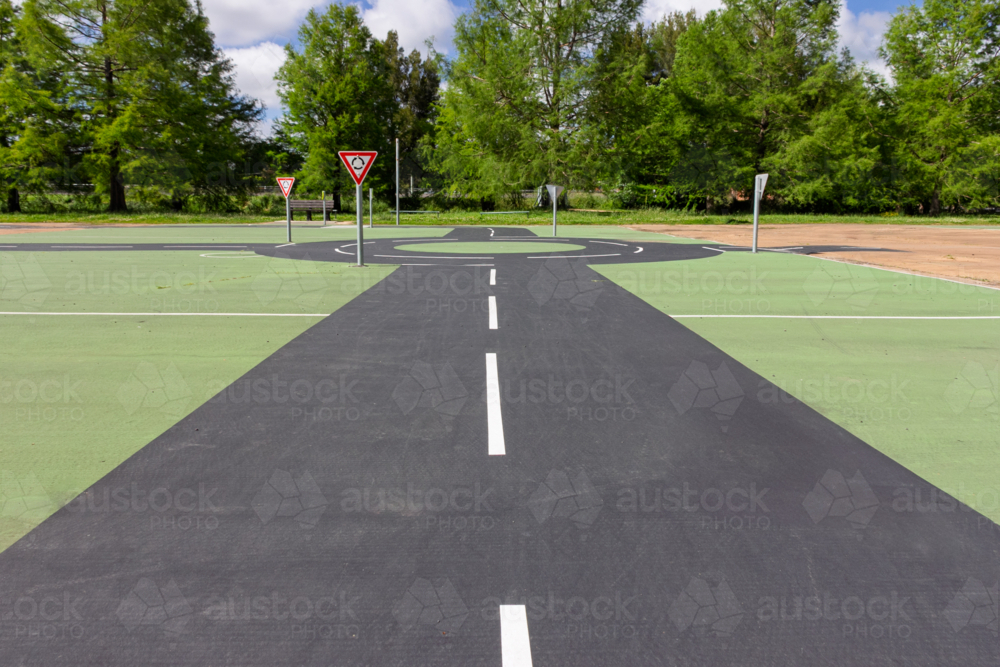 Roundabout and give way signs at children’s play park - Australian Stock Image