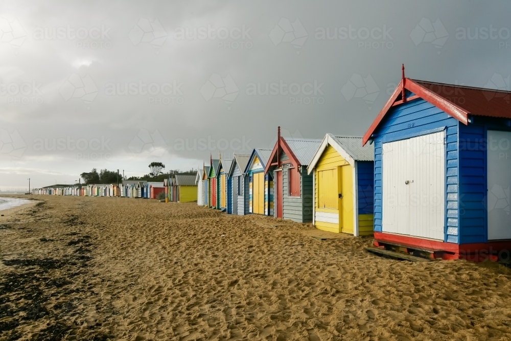 Row of bathing boxes at a city beach - Australian Stock Image