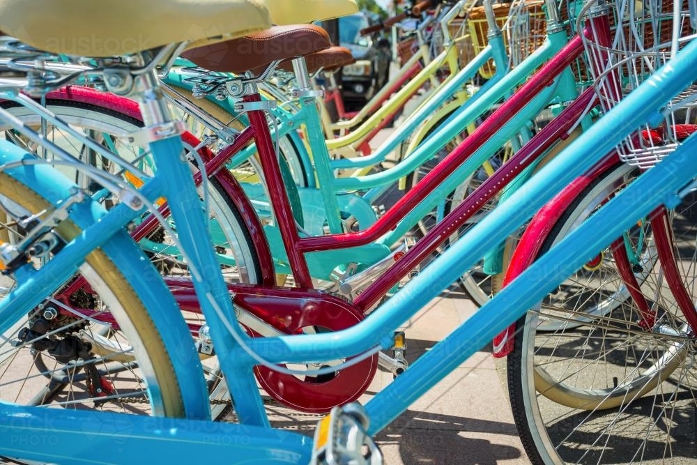 Row of brightly coloured bikes. - Australian Stock Image