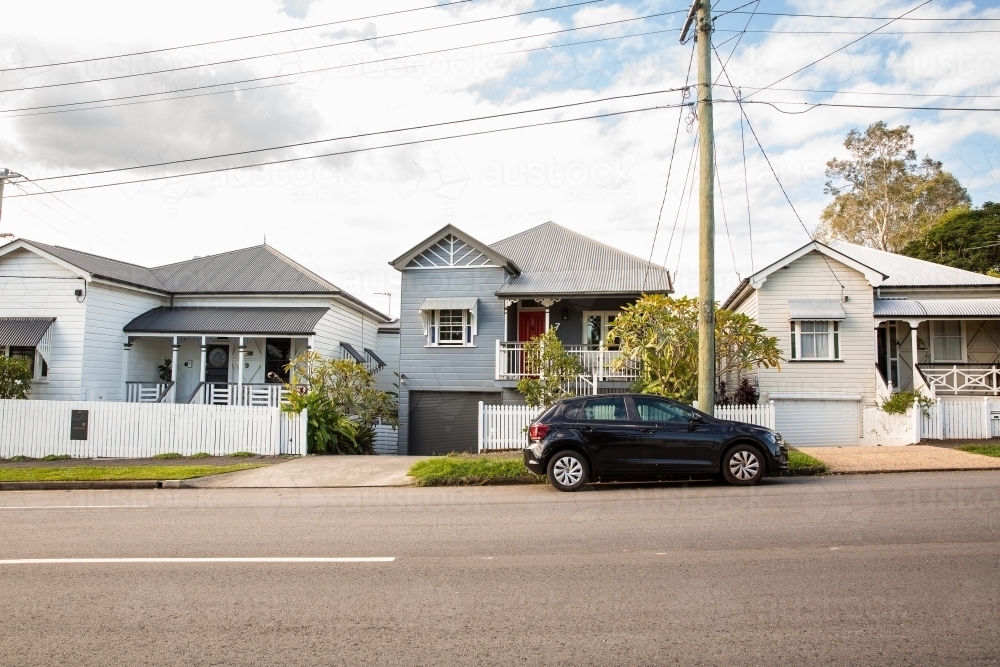 row of historical cottages on a suburban street in Brisbane - Australian Stock Image