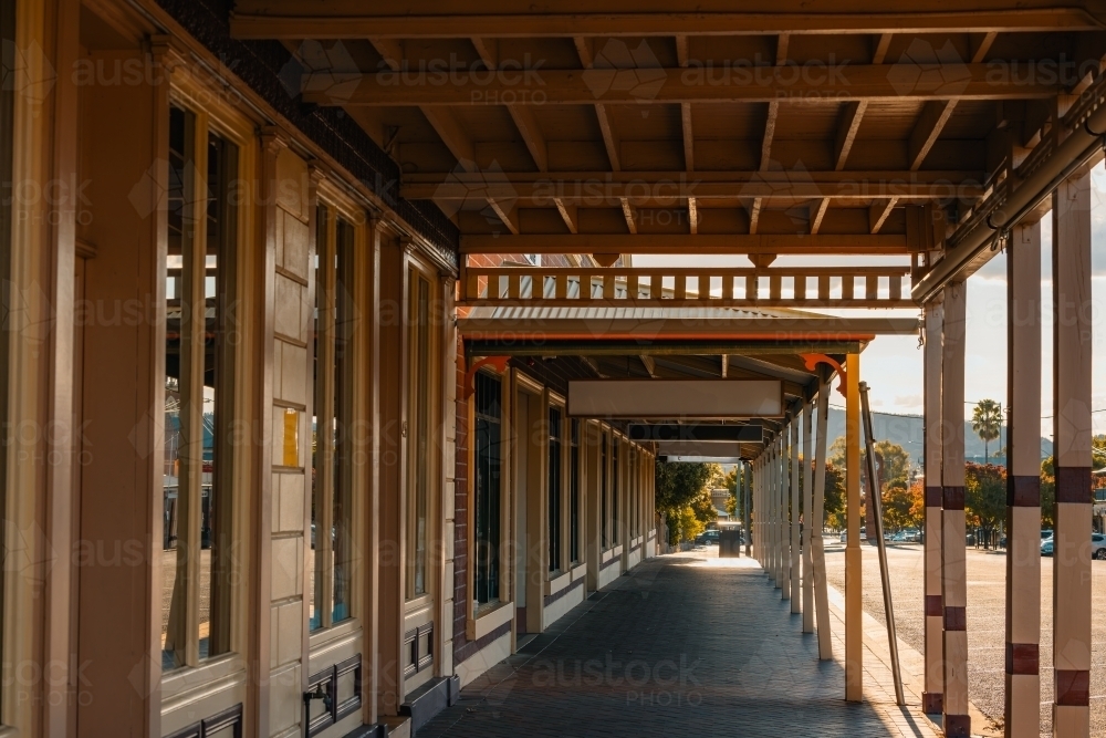 Image of Row of verandahs covering footpath along shopfronts in small ...
