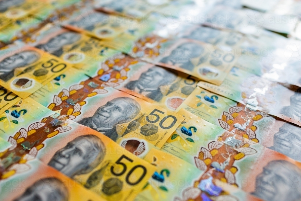 rows of bank notes, each the value of fifty Australian dollars - Australian Stock Image