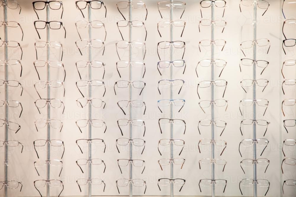 Rows of glasses and frames to choose from at the optometrist - Australian Stock Image