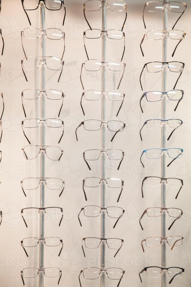 Rows of glasses and frames to choose from at the optometrist - Australian Stock Image