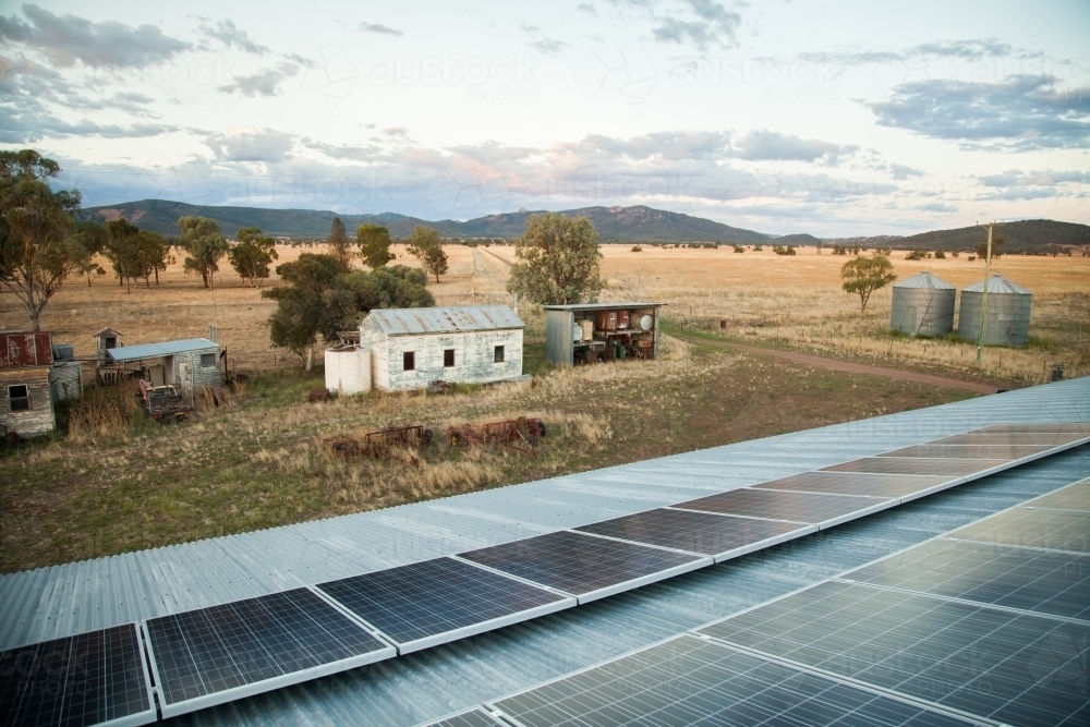 Rows of solar panels on roof of farm shed - Australian Stock Image