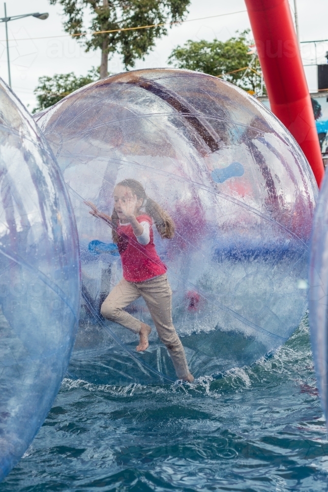 royal show, girl in large hamster water walking ball - Australian Stock Image