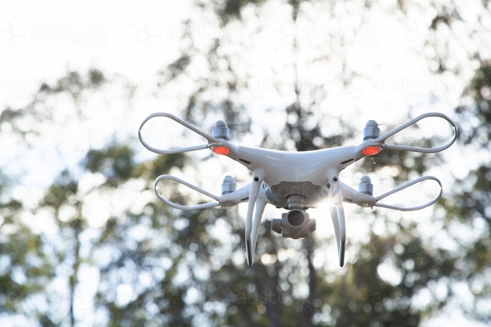 Image of RPA drone with sun flare and bokeh light - Austockphoto