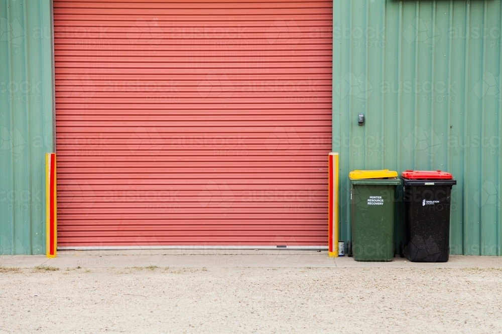 Rubbish and recycling bin outside shed - Australian Stock Image