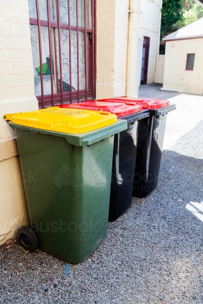 Rubbish and recycling bins outside of shop in Singleton - Australian Stock Image