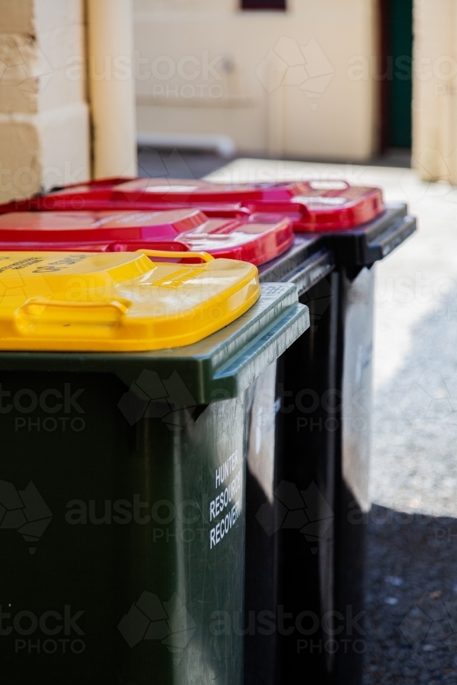 Rubbish and recycling bins outside of shop in Singleton - Australian Stock Image