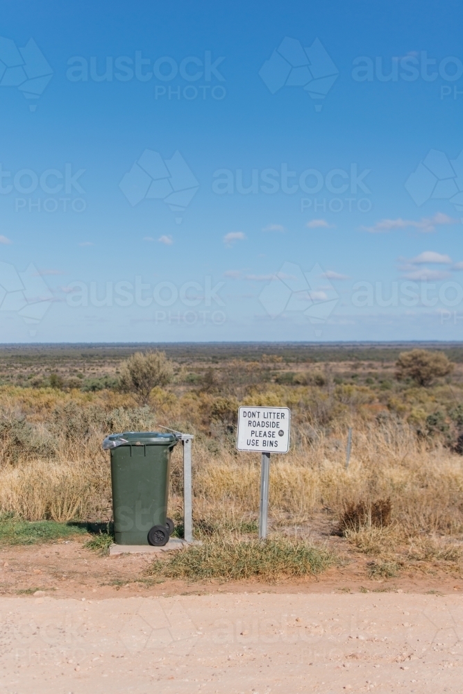 Rubbish bin and sign at roadstop - Australian Stock Image