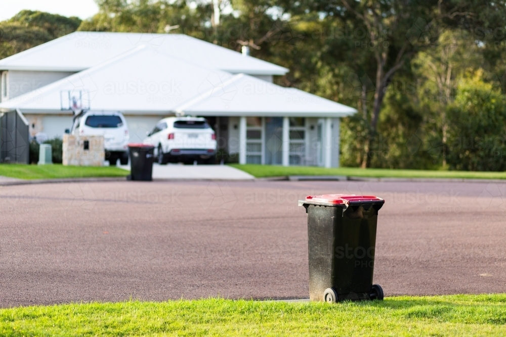 Image of Rubbish bin awaiting collection on suburban curb side