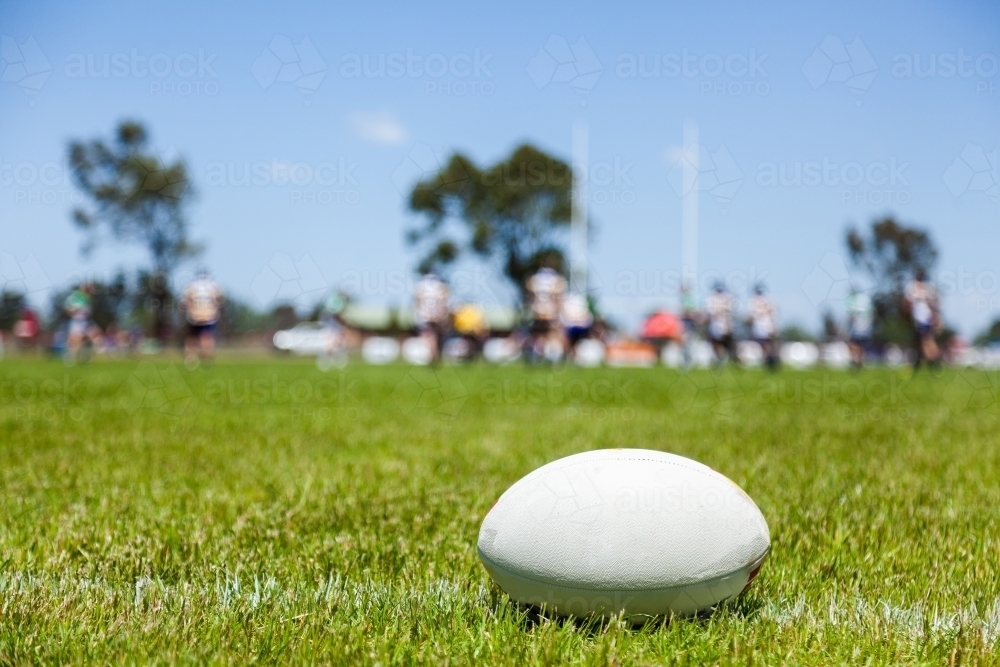 Rugby ball on with edge of the playing field during a game - Australian Stock Image