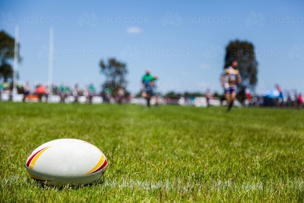 Rugby ball on with edge of the playing field during a game - Australian Stock Image