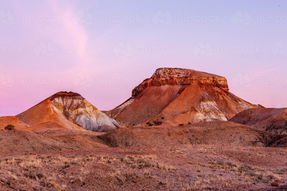 rugged hills in the Painted Desert at dusk - Australian Stock Image