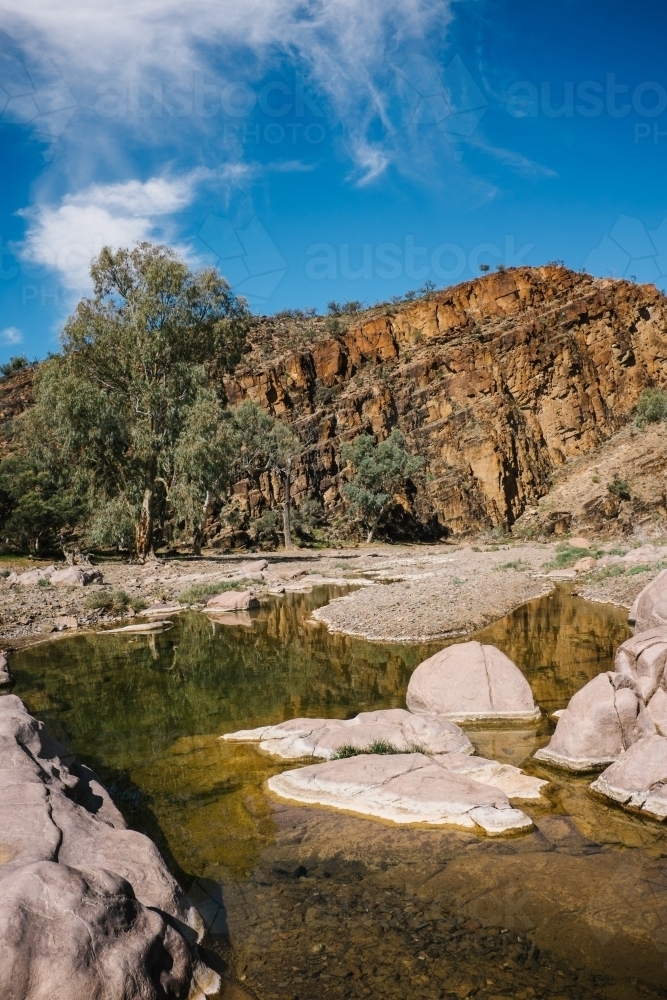Rugged rocky outback landscape with rock pools - Australian Stock Image
