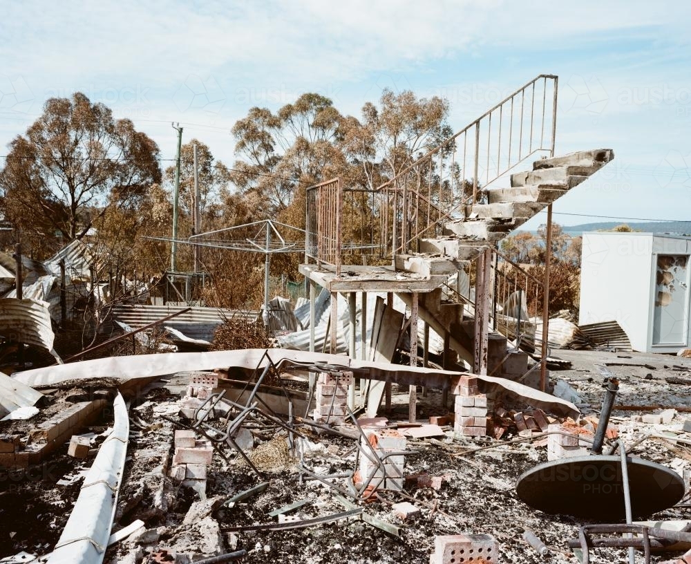 Ruined house in rubble after fire - Australian Stock Image