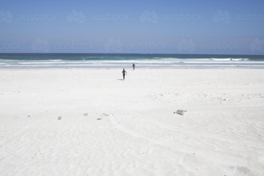 Running on beach to catch surf - Australian Stock Image