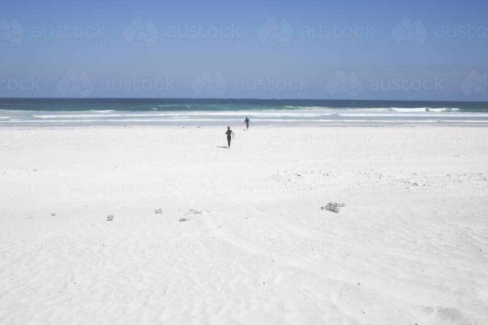 Running on beach to catch surf - Australian Stock Image