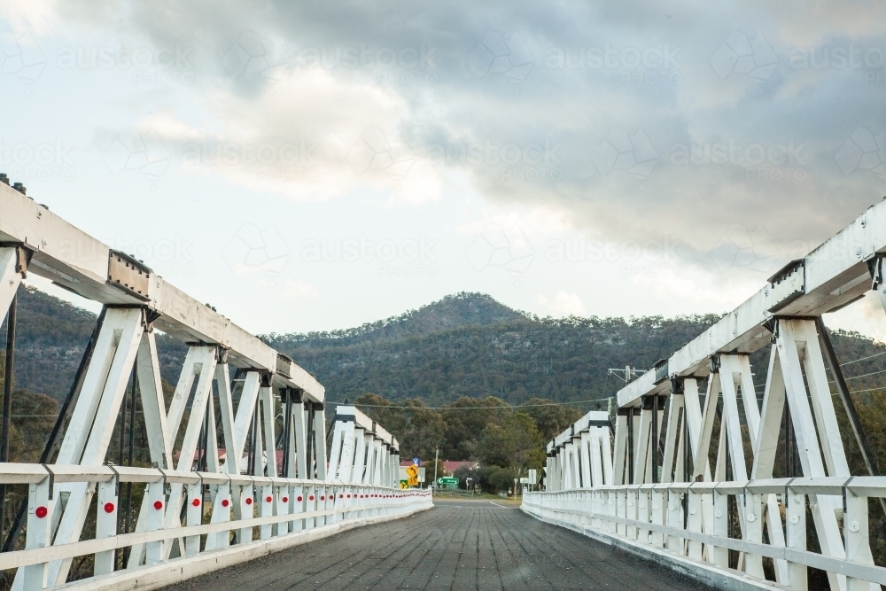 Image of Rural bridge over creek near Bulga hills - Austockphoto