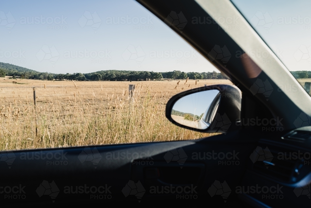 Rural country view through a car window during an afternoon weekend drive, Victoria, Australia - Australian Stock Image