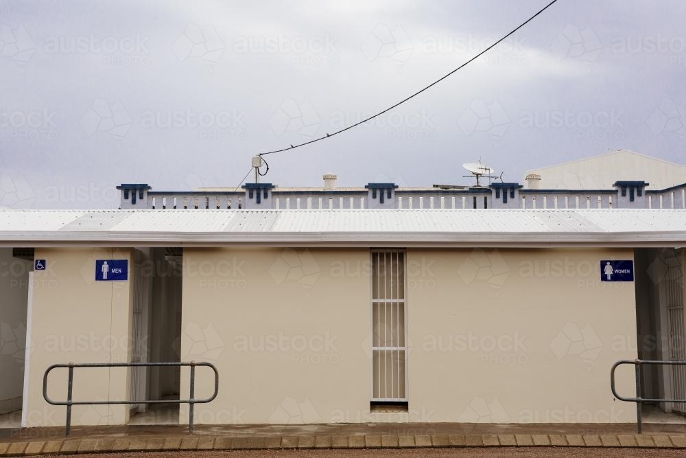 Rural outdoor male and female toilet block. - Australian Stock Image