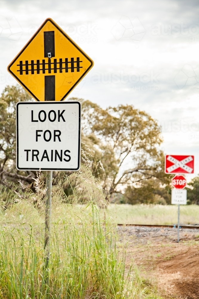Rural railway train crossing look for trains stop sign - Australian Stock Image