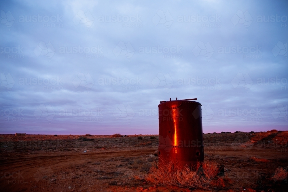 rusted old relic reflecting dawn light - Australian Stock Image