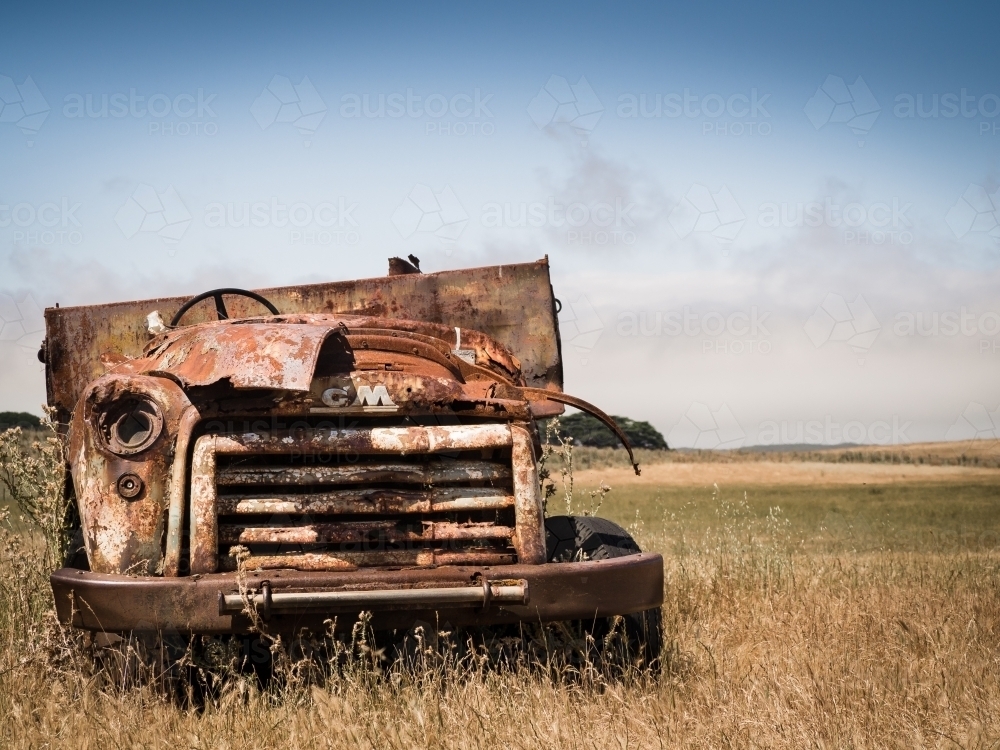 Rusted old truck abandoned in paddock - Australian Stock Image