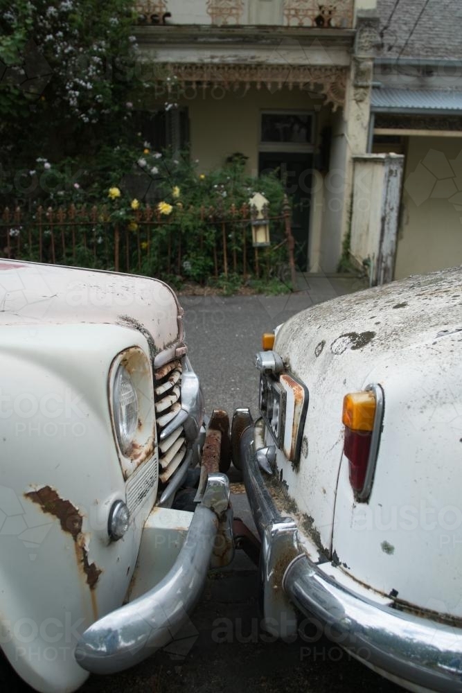 Image of Rusted vintage cars bumper to bumper Austockphoto