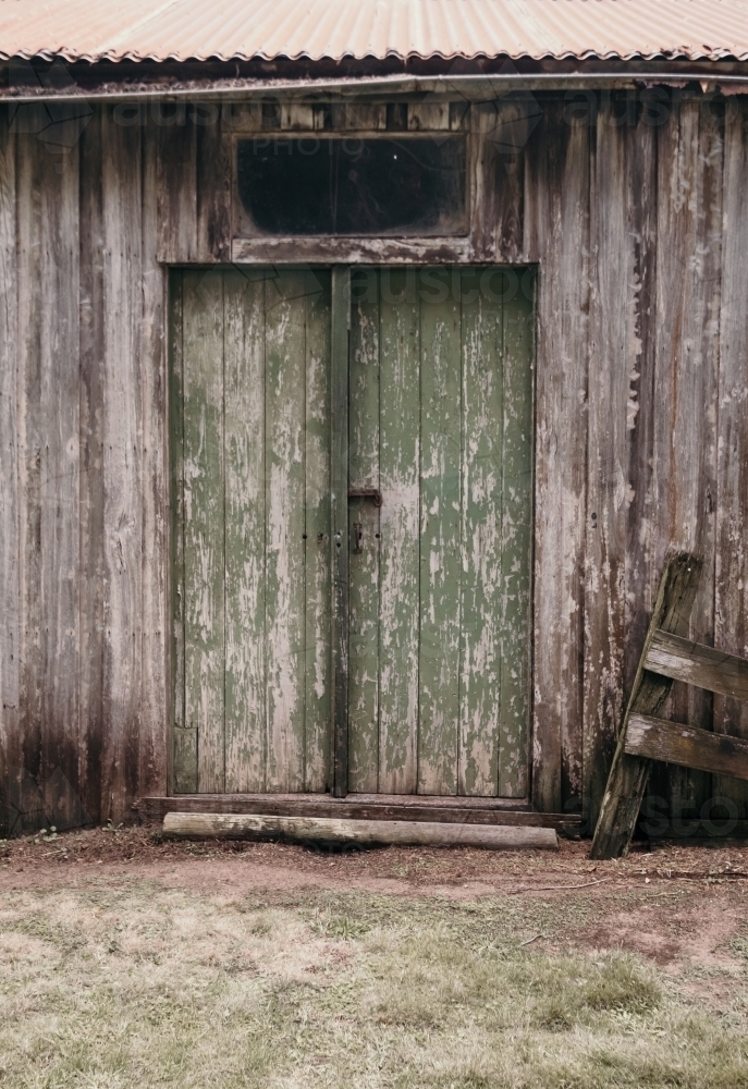 Rustic green wooden doors - Australian Stock Image