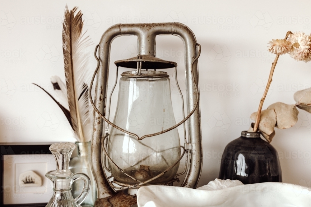 Rustic lamp among other decorative objects - Australian Stock Image