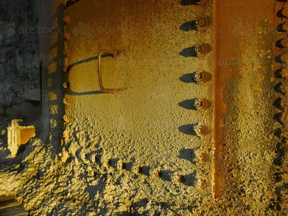 Rusty hatch on container at old mine site - Australian Stock Image