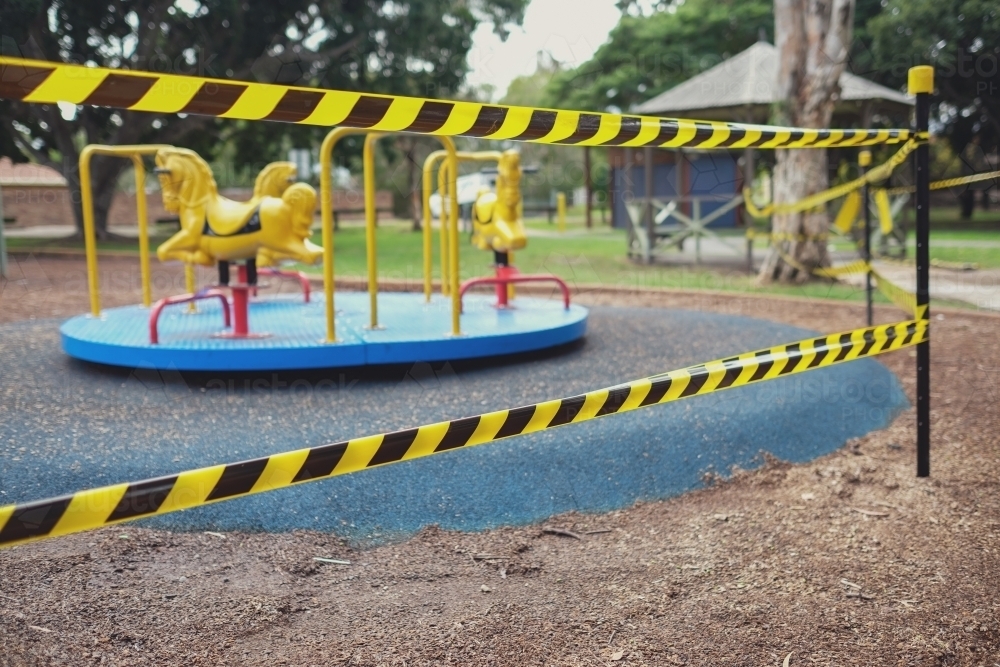 Safety black and yellow tape blocking off playground - Australian Stock Image