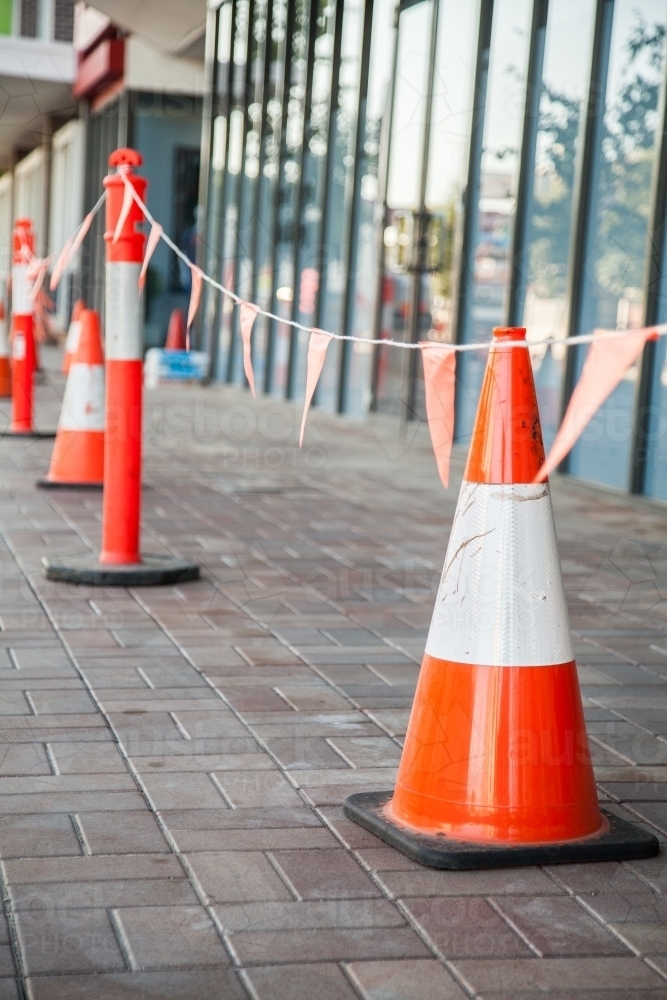 Image of Safety cones marking off hazard work site Austockphoto