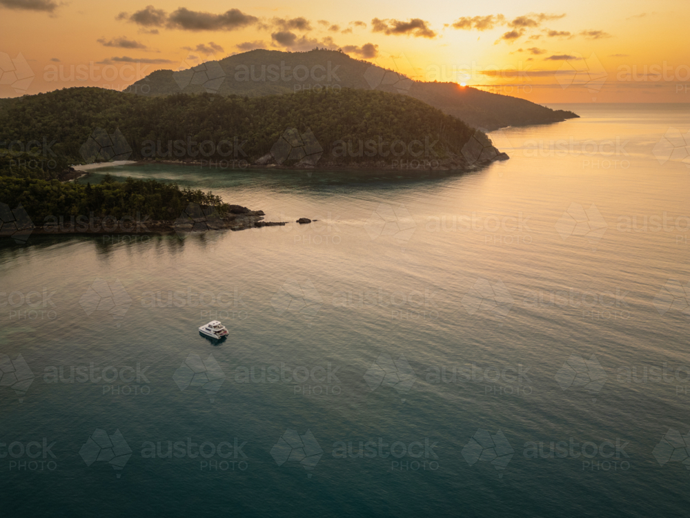 sailing boats in calm water near islands - Australian Stock Image