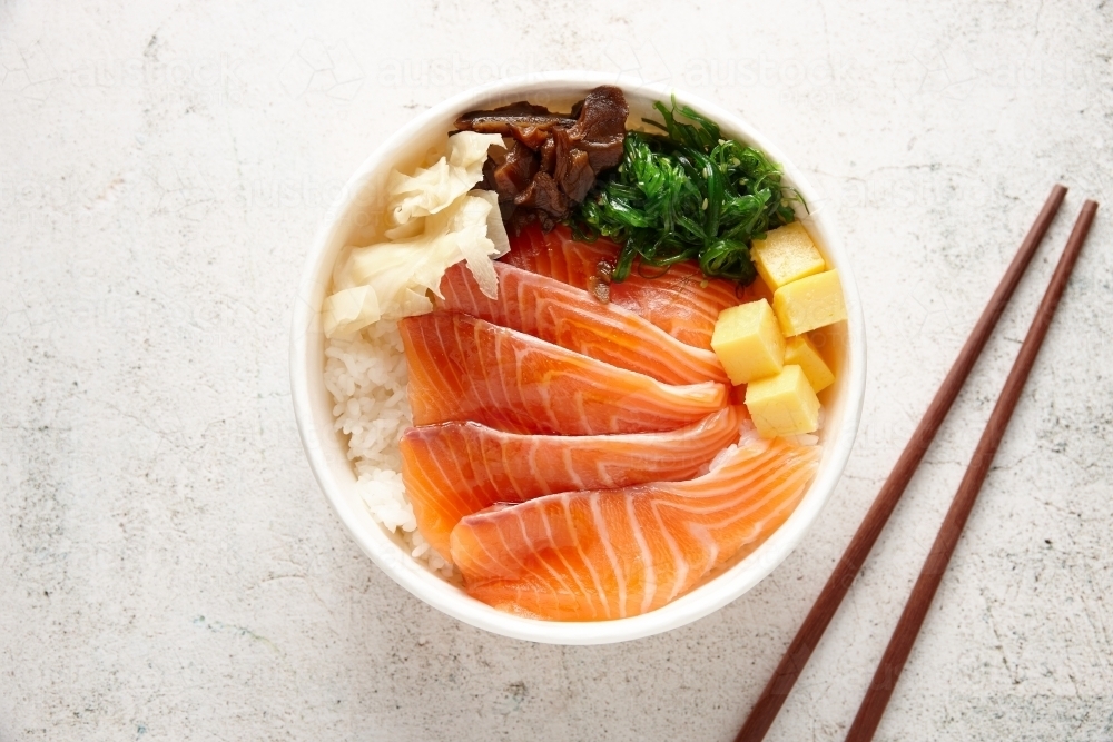 Salmon chirashi dish on table - Australian Stock Image