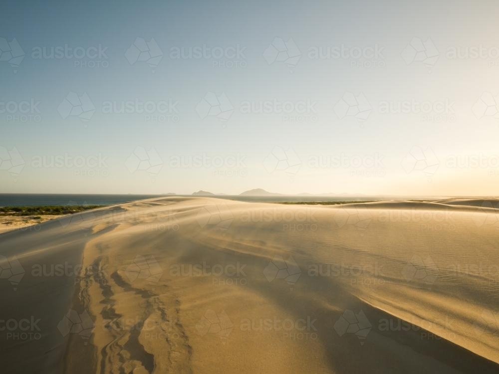 Sand blowing across a sand dune - Australian Stock Image