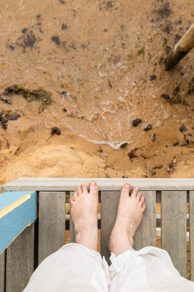 sand covered feet at the beach - Australian Stock Image