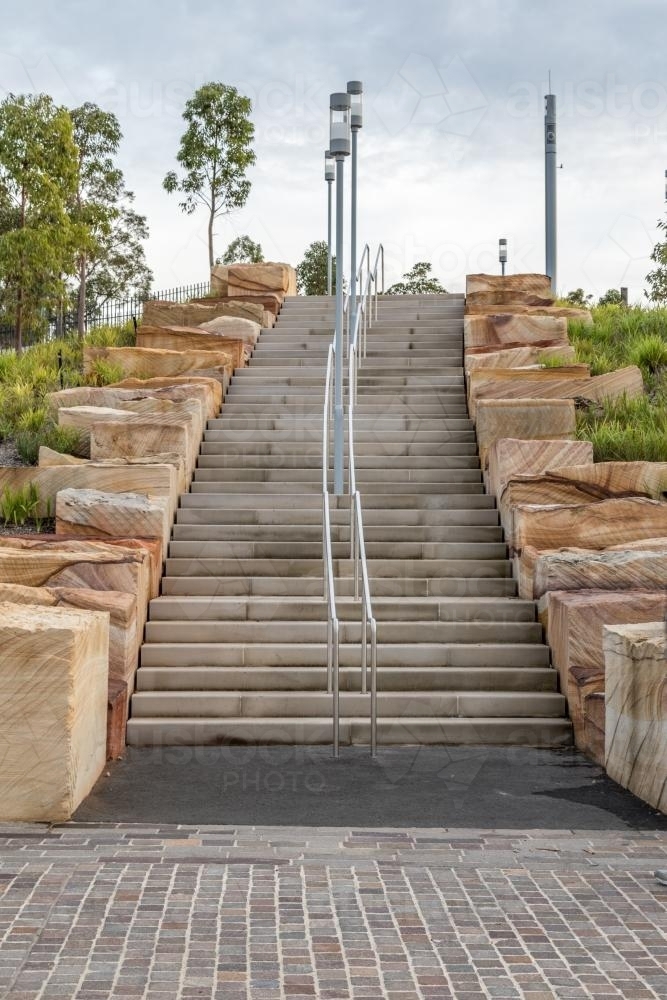 Sandstone stairs at Barangaroo, showing layered stone steps and clean architectural lines. - Australian Stock Image