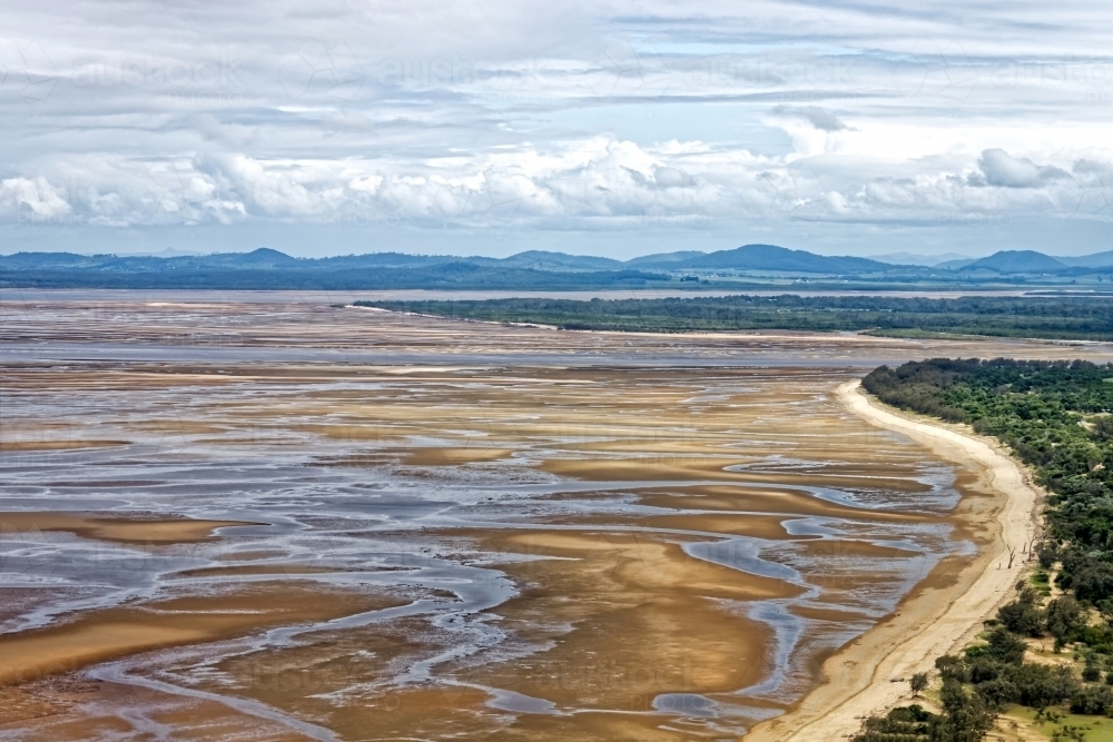 Sandy flats beach at king low tide in Mackay Region - Australian Stock Image