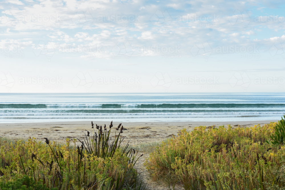Sandy path to ocean beach and early morning light - Australian Stock Image