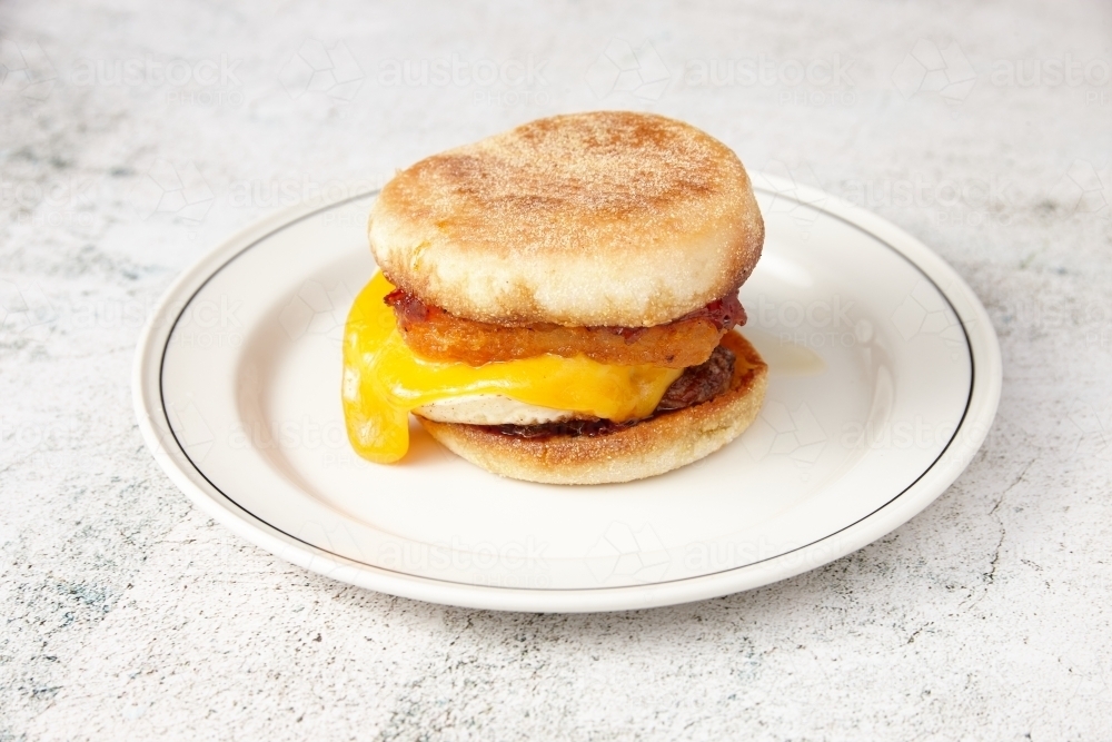 Sausage and egg muffin on plate - Australian Stock Image
