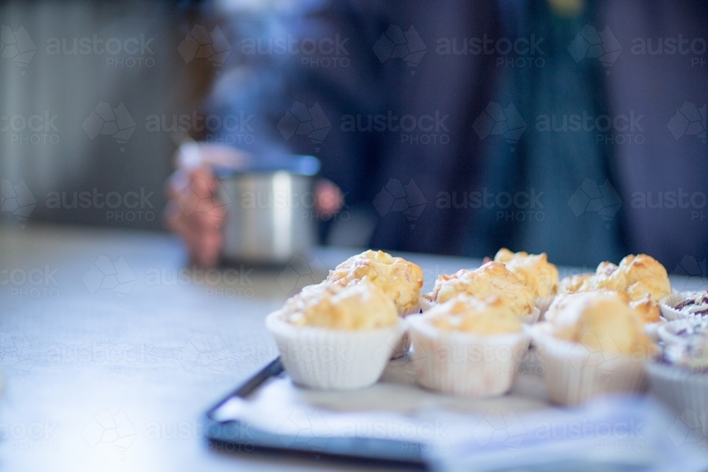 Savoury muffins and a cup of tea for smoko - Australian Stock Image